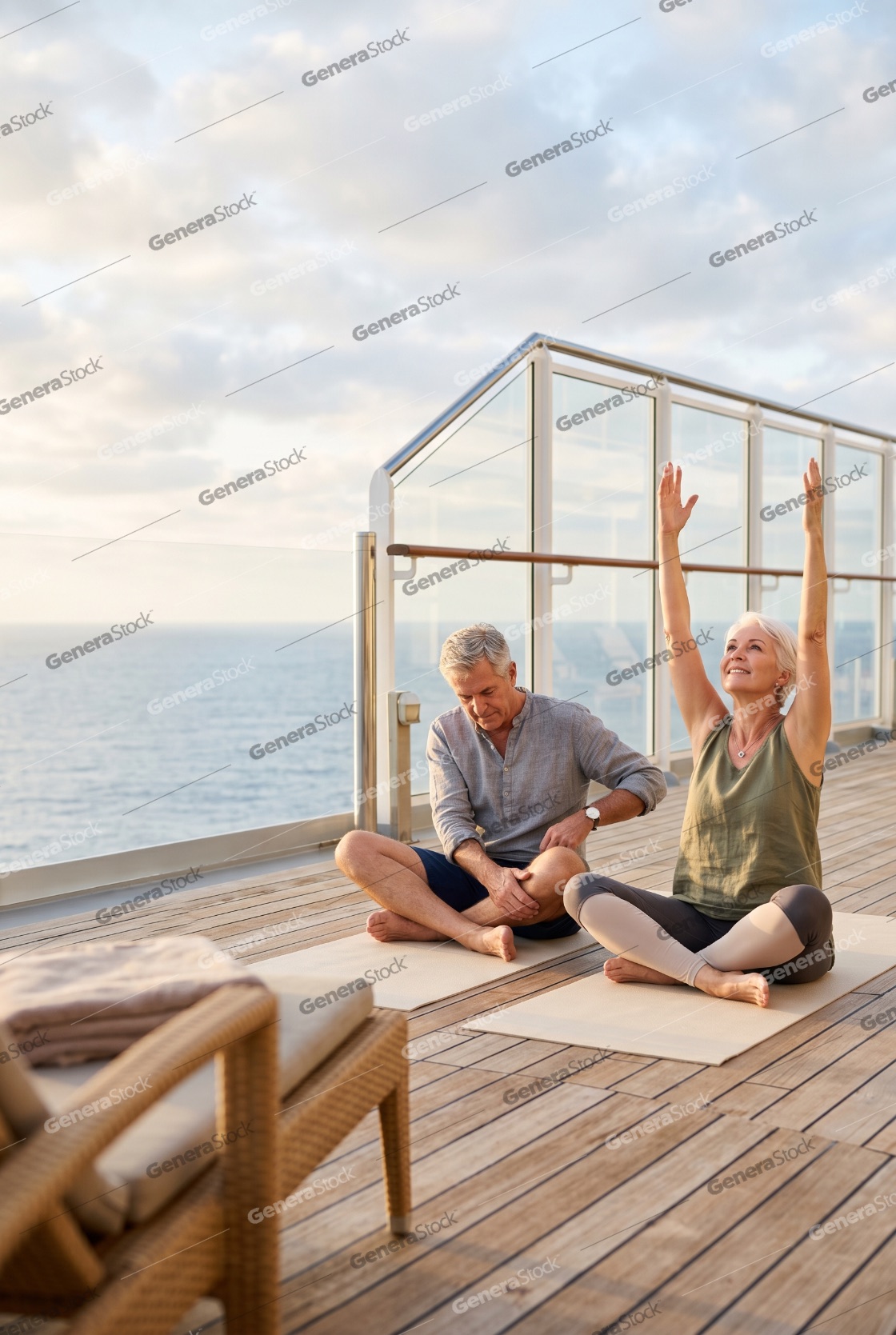 Active Senior Couple Practicing Yoga and Meditation on a Luxury Cruise Ship Deck with Ocean View