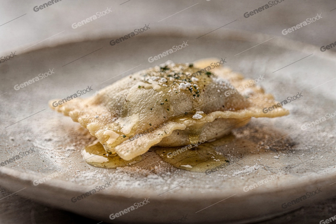 Gourmet fried Sardinian seadas dessert drizzled with golden hone
