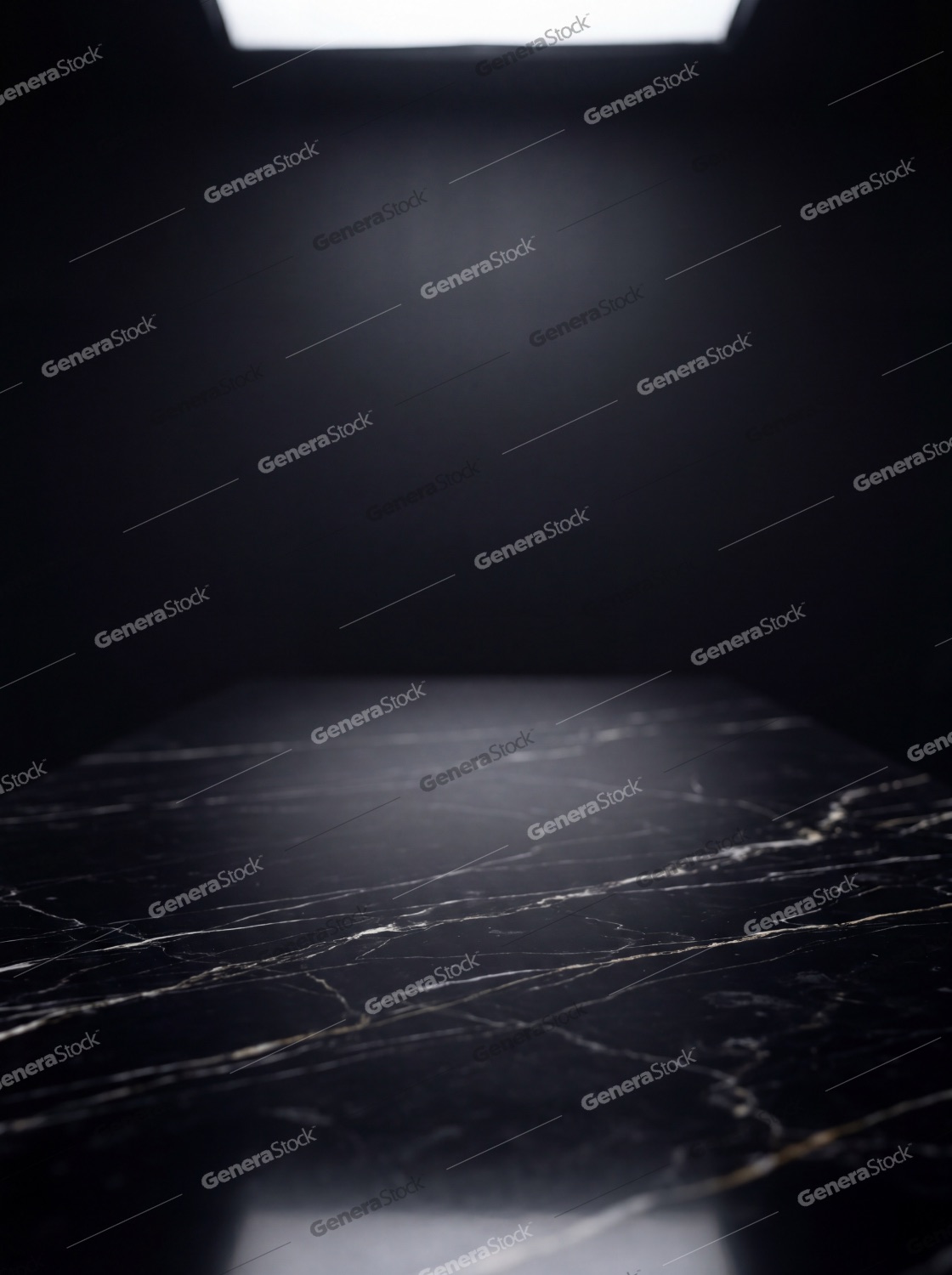Elegant black marble surface with dramatic overhead lighting for product display