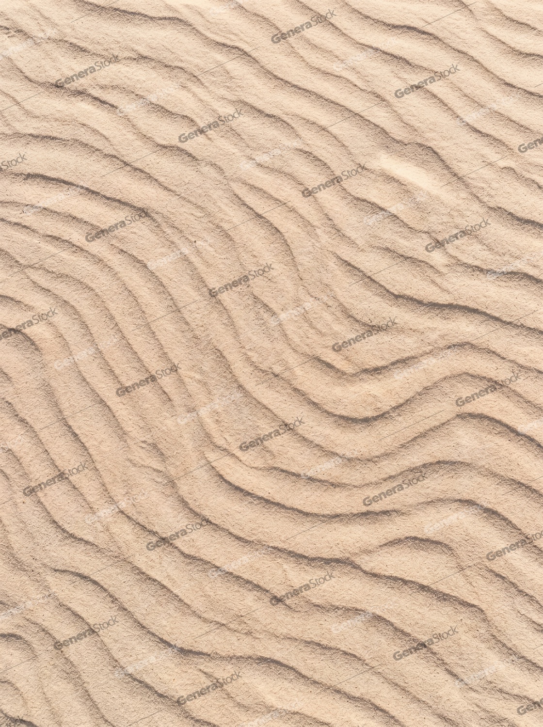 Natural sand ripples texture with wavy patterns formed by wind in a desert or beach environment