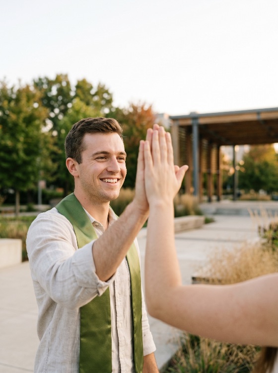 happy, young, male, graduate, green, stole, giving, high-five, celebrate, his, achievement, outdoors, graduation, success, celebration, student, university, college, happiness, smiling, campus, education, man, commencement, diploma, future, goal, teamwork, support, friendship, lifestyle, portrait, academic, degree, school, proud, joy, cheerful, adult, caucasian, park, sunny, golden, hour, ceremony, finished, accomplishment, people
