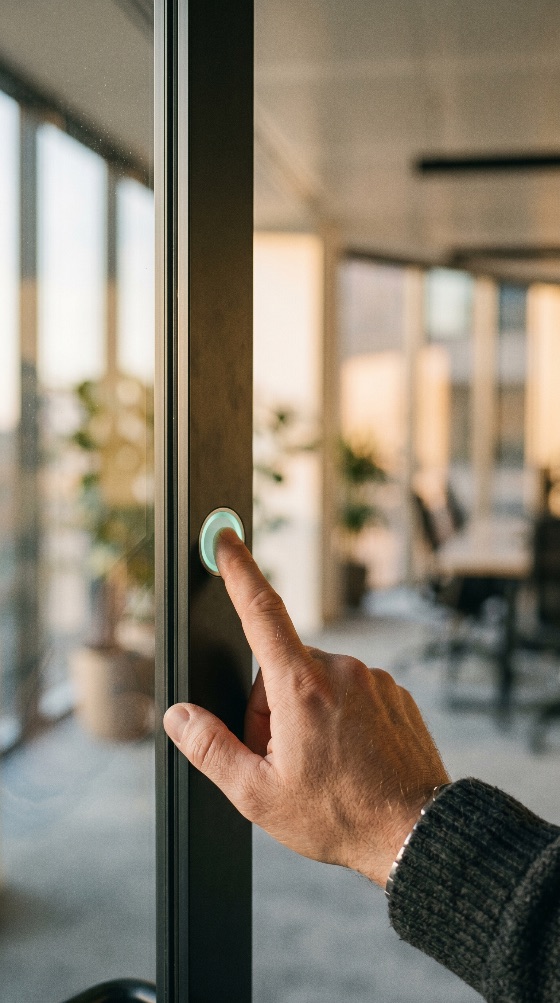 close-up, hand, pressing, glowing, green, button, modern, glass, office, door, frame, press, finger, light, access, control, security, technology, professional, business, entrance, exit, touch, electronic, smart, workspace, interior, corporate, automation, system, safety, push, illuminated, contemporary, detail, male, human, interaction, opening, closing, building, high-tech, innovative, finance