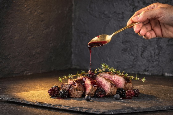 chef, pouring, delicious, blackberry, sauce, over, juicy, sliced, duck, person, hand, rich, red, berry, from, golden, spoon, freshly, tender, medium-rare, meat, garnished, with, sprigs, fresh, thyme, blackberries, and, blueberries, rustic, slate, board, set, against, dark, textured, background, steak, breast, gourmet, food, blueberry, dinner, meal, medium, rare, tenderloin, culinary, dish, restaurant, roasted, grilled, beef, venison, garnish, fine, dining, fruit, wine, reduction, cooking, tasty, cuisine, appetizer, photography, presentation, plate, platter, savory, backdrop, luxury, plating, mood, art, drink