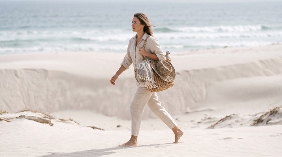 peaceful, woman, walking, barefoot, along, white, sand, beach, near, stylish, young, walks, serene, the, calm, sea, she, wears, relaxed, beige, linen, shirt, and, trousers, carrying, woven, tote, bag, filled, with, essentials, like, sun, hat, towel, water, bottle, scene, exudes, relaxation, quiet, luxury, summer, getaway, vibes, solitude, ocean, vacation, straw, coast, coastal, shore, shoreline, travel, lifestyle, relaxing, leisure, freedom, nature, outdoor, full, length, side, view, tranquil, beauty, fashion, style, adult, female, casual, holiday, dunes, sandy, resortwear, day, minimalist, neutral, scenic, seaside, horizon, landscapes
