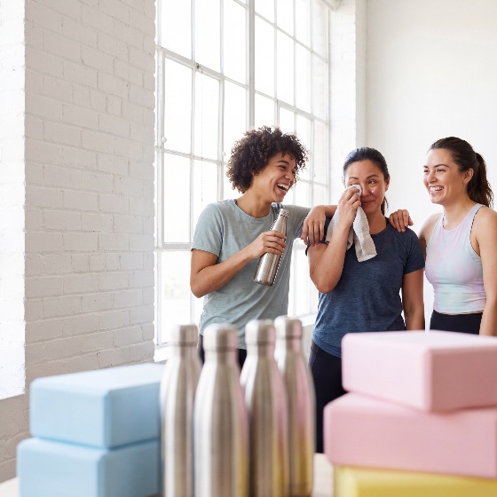 three, diverse, women, laughing, and, talking, after, workout, bright, yoga, studio, with, one, woman, wiping, sweat, another, holding, water, bottle, surrounded, equipment, fitness, friends, exercise, healthy, lifestyle, smiling, activewear, gym, wellness, friendship, multi-ethnic, social, happiness, post-workout, towel, blocks, indoor, health, vitality, together, support, motivation, athletic, sportswear, training, leisure, community, positivity, group, people, young, adults, diversity, inclusion, center, physical, activity, hydration, recovery, photography, commercial, stock, pilates