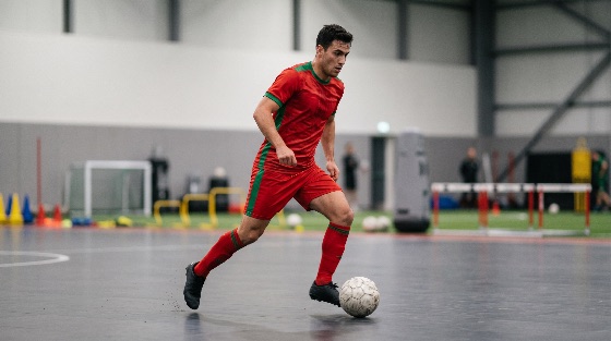 professional, soccer, player, red, uniform, dribbling, ball, indoor, court, during, training, football, athlete, sport, futsal, action, exercise, fitness, man, male, jersey, gym, practice, skill, movement, athletic, active, competition, game, hobby, lifestyle, person, young, stamina, strength, endurance, goal, hurdles, equipment, stadium, arena, sports