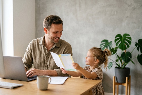 happy, father, working, from, home, laptop, while, young, daughter, shows, him, handmade, drawing, family, child, office, parent, remote, work, lifestyle, happiness, girl, man, bonding, together, childhood, art, modern, interior, desk, houseplant, monstera, work-life, balance, parenting, smiling, proud, telecommuting, people, indoor, sharing, love, career, professional, freelance, domestic, apartment, morning, casual, education, creativity, gift, card, greeting, preschooler, toddler, male, female