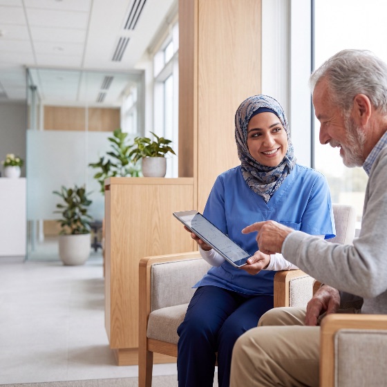 professional, female, healthcare, worker, hijab, discussing, medical, data, tablet, with, elderly, man, bright, clinic, highlighting, diverse, staff, and, patient, interaction, nurse, senior, muslim, diversity, hospital, technology, digital, health, care, consultation, woman, aging, communication, support, medicine, scrubs, uniform, wellness, assistance, nursing, home, geriatric, examination, results, smiling, friendly, indoor, modern, lifestyle, practitioner, specialist, caregiver, compassion, treatment, insurance, checkup, physician