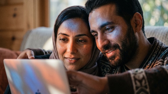 happy, young, muslim, couple, looking, laptop, screen, together, home, technology, smiling, hijab, husband, wife, browsing, internet, computer, lifestyle, middle, eastern, south, asian, ethnic, diversity, connection, love, communication, indoor, cozy, digital, online, shopping, planning, travel, finance, education, leisure, relationship, family, togetherness, modern, people, adult, man, woman, electronics, wireless, connectivity, social, media, remote, work, e-learning