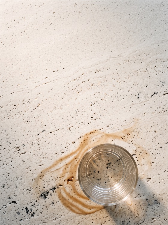 overhead, view, empty, glass, cup, coffee, stain, over, lig, top, clear, tumbler, sitting, brown, liquid, ring, spill, light, beige, travertine, marble, countertop, the, composition, features, natural, directional, sunlight, casting, subtle, shadows, creating, minimalist, aesthetic, with, copy, space, for, design, elements, stone, background, flat, lay, texture, surface, neutral, drink, shadow, messy, dirty, beverage, clean, abstract, detail, from, above, mark, table, porous, bright, modern, spot, transparent, home, kitchen, pattern, splash, backgrounds, textures