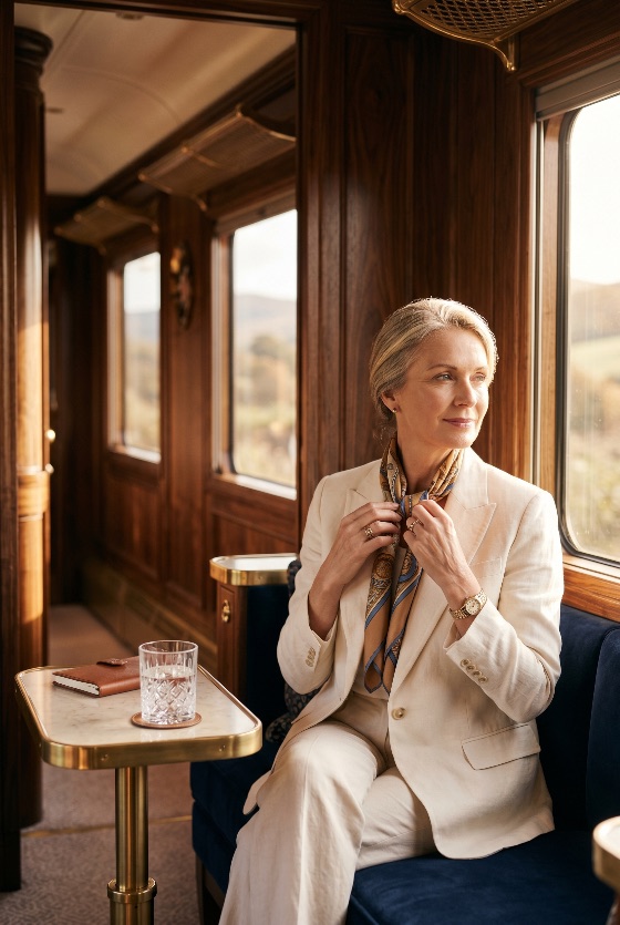 sophisticated, mature, woman, elegant, linen, suit, traveling, luxury, vintage, train, carriage, travel, lifestyle, wealth, passenger, journey, interior, wood, window, scarf, fashion, senior, middle-aged, first, class, transport, vacation, calm, peaceful, style, jewelry, watch, crystal, glass, notebook, tourism, transportation, places